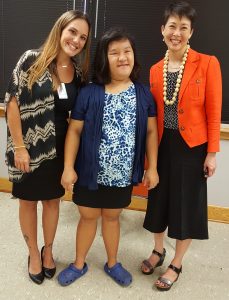 DHS Dir. Rachael Wong (right) honors a summer intern (middle) with a fellow State of Hawaii employee. 