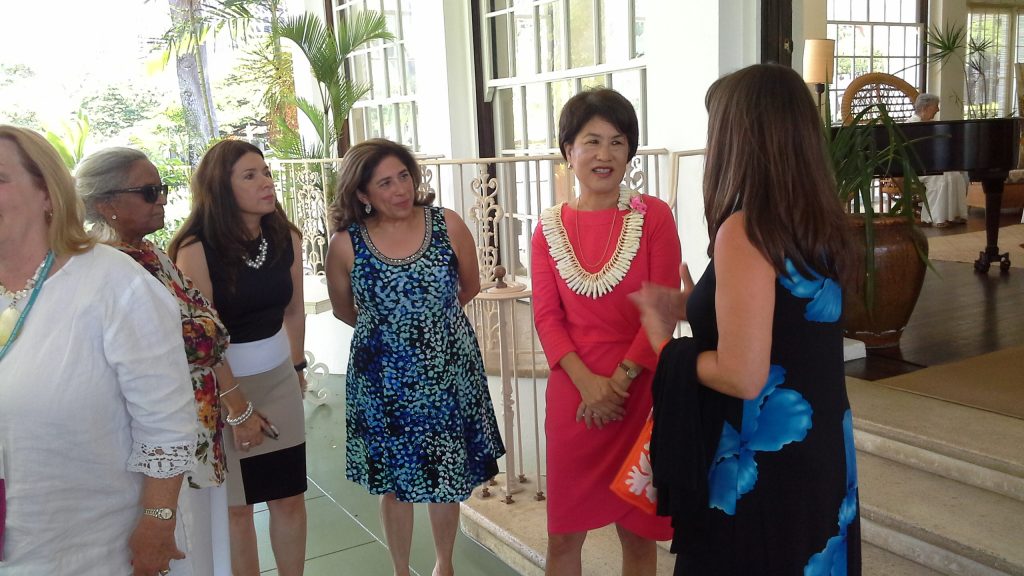 Conference attendees converse with First Lady Dawn Amano-Ige.
